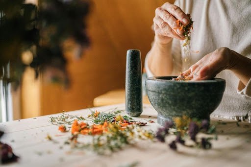 Woman preparing an essential oil blend. 