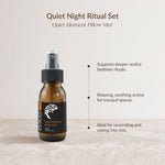 An amber glass spray bottle labeled PURAS Quiet Moment Pillow Mist, shown on a light beige textured surface against a matching background with descriptive text about its calming bedtime ritual benefits.