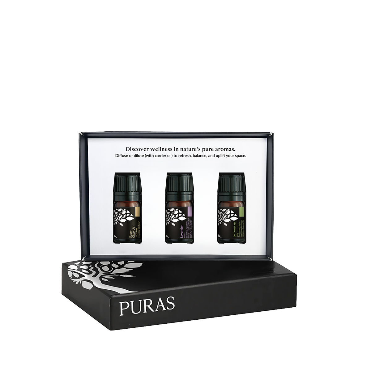 Puras wellness diffuser set featuring three essential oil bottles displayed inside an open black presentation box, with the brand name PURAS printed on the closed box below.