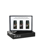 Puras wellness diffuser set featuring three essential oil bottles displayed inside an open black presentation box, with the brand name PURAS printed on the closed box below.