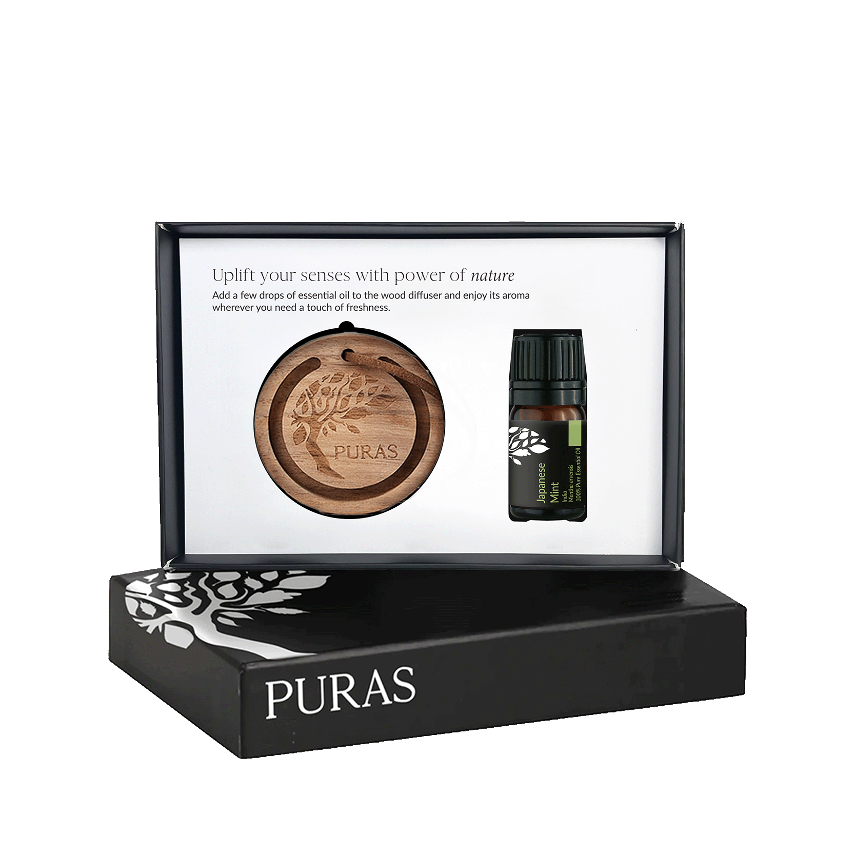 Puras essential oil gift set in a black presentation box, featuring a round wooden diffuser tray and a small dark glass essential oil bottle with a black cap, shown against a white background.