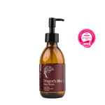 maroon bottle of Dragon's Blood Face Wash with a pump on a plain background