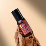 Puras Dragon's Blood Intense Peptide Glow Serum bottle on a wooden block with a beige background