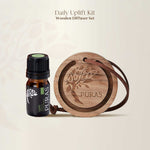 Wooden diffuser set with Puras essential oil bottle on a beige background