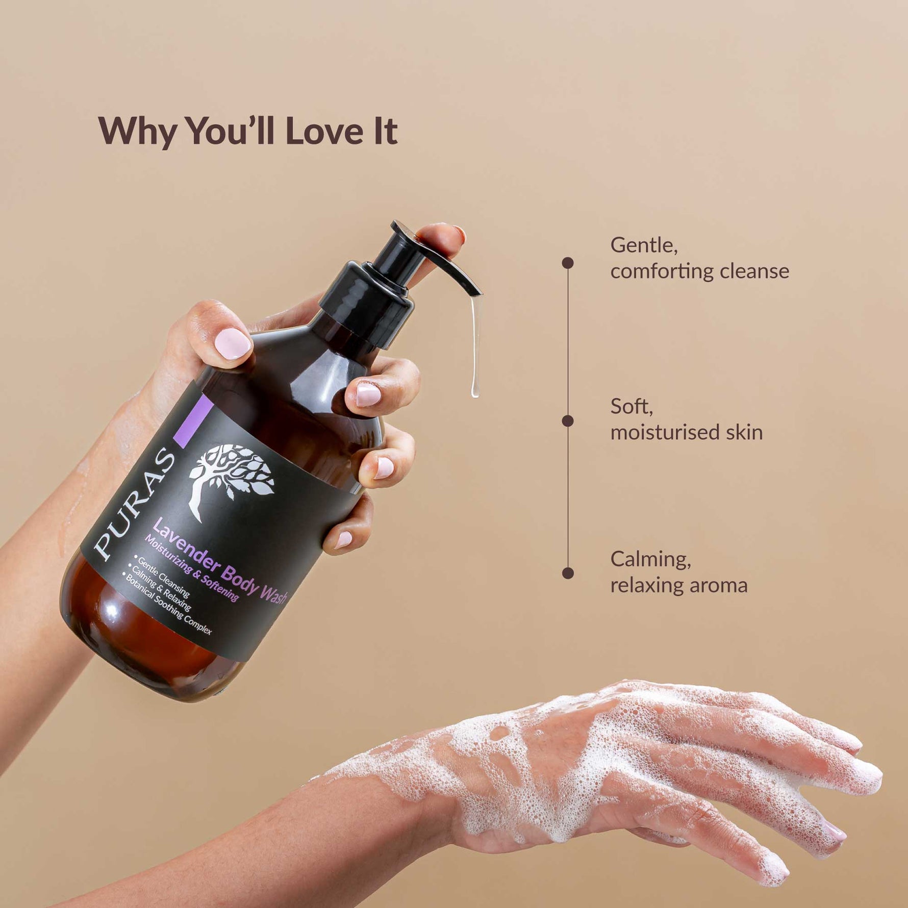 Puras lavender body wash bottle with a hand holding it and another hand with soap suds on a beige background.